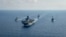 Royal Australian Navy guided-missile frigate HMAS Parramatta (FFH 154) (L) sails with U.S. Navy Amphibious assault ship USS America (LHA 6), Ticonderoga-class guided-missile cruiser USS Bunker Hill (CG 52) and Arleigh-Burke class guided missile destroyer.