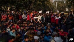 FILE - Indian wrestlers and their supporters participate in a protest against Wrestling Foundation of India President Brij Bhushan Sharan Singh and other officials in New Delhi, India, Jan. 19, 2023.