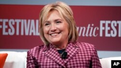 FILE - Former Secretary of State Hillary Clinton talks with Jeffrey Goldberg, editor in chief of The Atlantic, during The Atlantic Festival, in Washington.