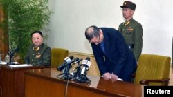 One of the two men whom North Korea identified as being South Korean and accused of being a spy for South Korea bows during a news conference in Pyongyang, in this undated photo released by North Korea's Korean Central News Agency (KCNA) in Pyongyang, Mar