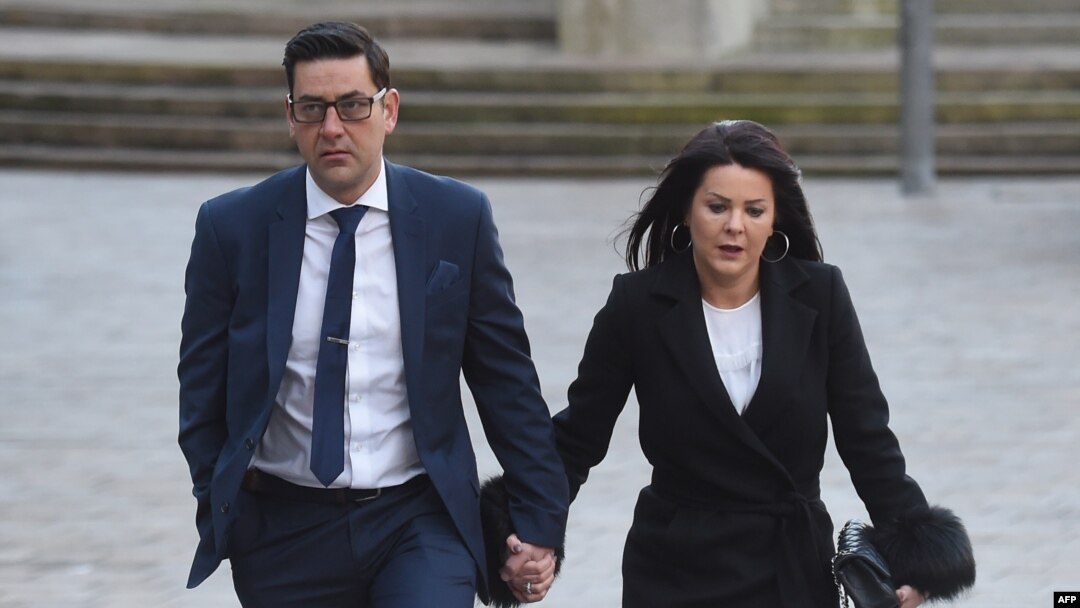 FILE - Former footballer and victim of abuse Andy Woodward (L) arrives at court with his partner Zelda in Liverpool on Jan. 8, 2018 on the first day of the trial of former football coach Barry Bennell.