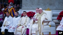 Pope Francis presides over the Christmas Eve Mass in St. Peter's Basilica at The Vatican, Dec. 24, 2024, after opening the basilica's Holy Door marking the start of the Catholic jubilar year 2025.