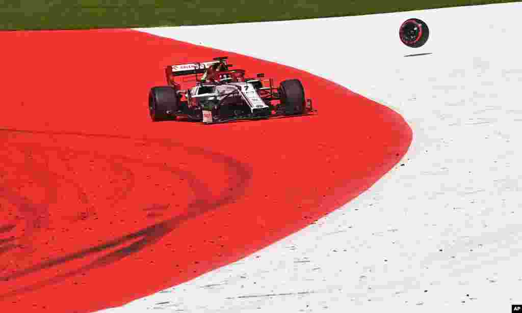 Alfa Romeo driver Kimi Raikkonen of Finland steers his damaged car after crashing during the Austrian Formula One Grand Prix at the Red Bull Ring racetrack in Spielberg, Austria.