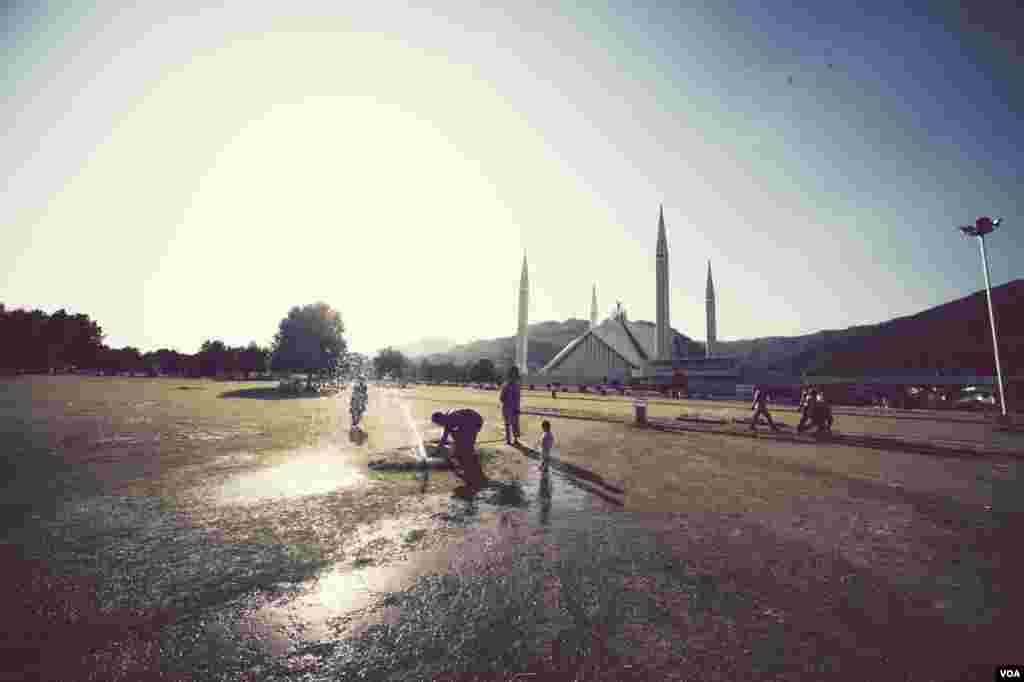 Nepali Hindu women recite prayers led by a priest as they sit on the banks of the Bagmati River during the Rishi Panchami festival in Kathmandu.