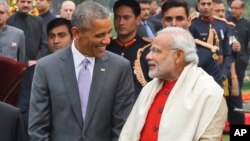 U.S. President Barack Obama, second right and first lady Michelle Obama, left stand with Indian Prime Minister Narendra Modi.