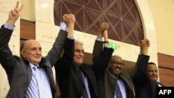 African Union and Ethiopian mediators celebrate after Sudan's protesters and ruling generals inked an agreement in Khartoum, July 17, 2019.