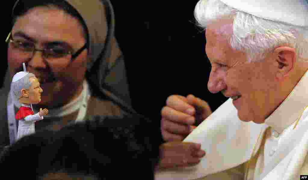 Pope Benedict XVI receives a replica of himself at the Nen Deu institute in Barcelona, Spain, Sunday, Nov. 7, 2010. The Pope consecrated La Sagrada Familia, the Barcelona landmark designed by Antoni Gaudi, whose construction began in 1882 and continues to