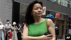 FILE - Cheng Lei, a Chinese-born Australian journalist for CGTN, the English-language channel of China Central Television, attends a public event in Beijing, China, Aug. 12, 2020.