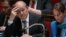 French Defence Minister Jean-Yves Le Drian (L) and French Environment and Energy Minister Segolene Royal attend a session of questions to the government at the National Assembly, on May 07, 2014 in Paris. 