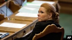 FILE - Jan. 26, 2016 photo, then Denmark's Minister of Integration Inger Stoejberg sits in Parliament. Ruling party says it will back a vote in parliament on whether the former immigration minister can be tried before the rarely used Court of Impeachment.