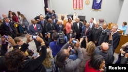 Surviving members of the "Friendship Nine" gather to have their trespassing convictions vacated at a courthouse in Rock Hill, South Carolina, Jan. 28, 2015.