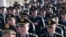 Military delegates from the Chinese People's Liberation Army (PLA) walk towards the Great Hall of the People for a plenary meeting of the National People's Congress (NPC), China's parliament, in Beijing, March 4, 2014.