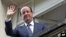 France's newly-elected President Francois Hollande at his campaign headquarters a day after his election, in Paris, May 7, 2012.