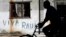 A man rides his bicycle near a graffiti that reads, "Long live Raul," in Havana, Cuba, Dec. 19, 2014. 