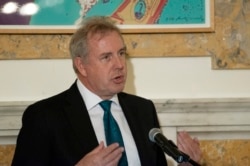 In this Oct. 20, 2017 photo, British Ambassador Kim Darroch hosts a National Economists Club event at the British Embassy in Washington.