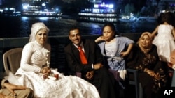 Egyptian couples celebrate their wedding party at a bridge over the Nile in Cairo (file photo)