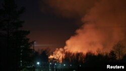 Smoke is seen rising from a fire that broke out at a penal colony after a riot by inmates, in Angarsk, Russia, April 11, 2020. 