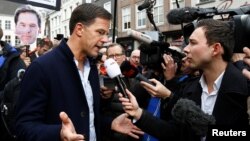 Dutch Prime Minister Mark Rutte of the VVD Liberal party speaks to the media as he campaigns for the 2017 Dutch election in Breda, Netherlands, March 11, 2017. 