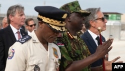 U.S. Secretary of State Antony Blinken walks with the Commander of the Multinational Security Support Mission Commander Godfrey Otunge and the Haitian National Police General Director Rameau Normal, left, in Port Au Prince, Haiti on Sept. 5, 2024.