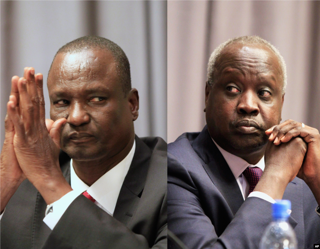 Taban Deng Gai, left, head of the rebel delegation and South Sudan&#39;s leader of the government delegation, Nhial Deng Nhial, attend the opening ceremony of South Sudan&#39;s peace negotiations, Addis Ababa, Ethiopia, January 4, 2014.