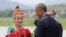 U.S. President Barack Obama receives flowers as he arrives at the Luang Prabang International Airport in Laos, Sept. 7, 2016.