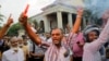 Supporters of ousted Sri Lankan Prime Minister Ranil Wickremesinghe celebrate outside the supreme court complex in Colombo, Dec. 13, 2018. 