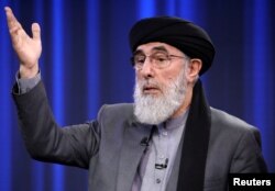 Former Afghan warlord and presidential candidate Gulbuddin Hekmatyar speaks during the presidential election debate at TOLO TV studio in Kabul, Sept. 25, 2019.