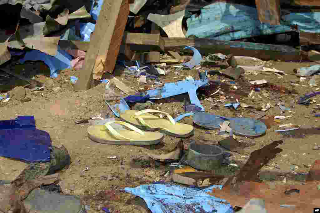 Shattered remnants are seen at the site of a bomb blast at a bar in the Nigerian northeastern city of Maiduguri July 3, 2011. An explosion killed at least five people and injured 10 more on Sunday at a bar near a police barracks in Nigeria's northeastern 