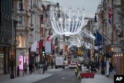General view of a near empty New Bond Street, in London, Tuesday, Dec. 22, 2020.