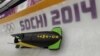 The JAM-1 sled from Jamaica, takes a turn during a training run for the men's two-man bobsled at the 2014 Winter Olympics, Feb. 6, 2014, in Krasnaya Polyana, Russia.