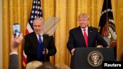U.S. President Donald Trump delivers joint remarks on a Middle East peace plan proposal with Israel's Prime Minister Benjamin Netanyahu in the East Room of the White House in Washington, Jan. 28, 2020.
