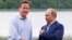 Britain's Prime Minister David Cameron (l) and Russia's President Vladimir Putin during arrivals for the G-8 summit at the Lough Erne Golf Resort in Enniskillen, Northern Ireland, June 17, 2013. 