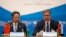 Serbian President Aleksandar Vucic, right, and Chinese Transport Minister Li Xiaopeng attend a meeting of China and 16 countries of central and eastern Europe in Belgrade, Serbia, Oct. 16, 2018.