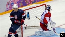 USA forward T.J. Oshie scores in shootout against Russia during men's ice hockey matchup at the 2014 Winter Olympics, Sochi, Feb. 15, 2014.