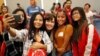 FILE - Rep. Jacky Rosen, D-Nev., center, poses for a selfie with high school students at an event put on by the Asian Community Development Council in Las Vegas, Sept. 29, 2018. 