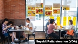 People eat at the Red Chicken Thai restaurant as Los Angeles County moves into life up restrictive coronavirus disease (COVID-19) disease reopening tier, in San Gabriel Valley, California, U.S., June 15, 2021