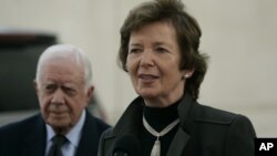 FILE - Former Irish President Mary Robinson, right, and former U.S. President Jimmy Carter speak to press in the West Bank city of Ramallah, Oct. 20, 2010. 
