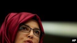FILE - Hatice Cengiz, the fiancee of slain Saudi journalist Jamal Khashoggi, gives a statement during a hearing about human rights situation in the Arab Peninsula at the European Parliament in Brussels, Tuesday, Feb. 19, 2019. 