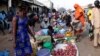 South Sudanese civilians conduct business at the market in Yei, southwest of the capital Juba, Jan. 1, 2017.