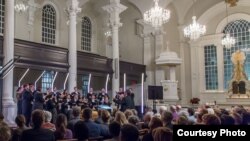 The Choir of Trinity Wall Street, under conductor Julian Wachner, performs The Psalms Experience at St. Paul's Chapel. (Kevin Yatarola)