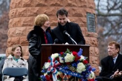 FILE - Kathy Daniels Tedeschi, L, whose husband died in the Pan Am Flight 103 bombing, hugs Ken Dornstein, producer of "My Brother's Murderer," at the 27th anniversary for the victims, at Arlington National Cemetery in Vriginia, Dec. 21, 2015.