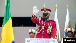 FILE - Gabon coup leader Gen. Brice Oligui Nguema is sworn in as interim president in Libreville on Sept. 4, 2023. Nguema said on Oct. 5, 2023, that he traveled to the Central African Republic to explain the motivations behind the coup and seek an end to international sanctions.