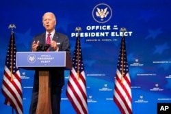 FILE - President-elect Joe Biden speaks at The Queen theater, in Wilmington, Delaware, Dec. 4, 2020.