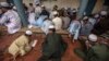 FILE - Pakistani religious students attend a lesson at Darul Uloom Haqqania, an Islamic seminary and alma mater of several Taliban leaders in Akora Khattak, Khyber Pakhtunkhwa province.