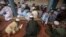 FILE - Pakistani religious students attend a lesson at Darul Uloom Haqqania, an Islamic seminary and alma mater of several Taliban leaders in Akora Khattak, Khyber Pakhtunkhwa province.