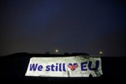 FILE - A projection appears on a wall in Ramsgate, southern England, on Brexit Day, Jan. 31, 2020.