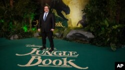 Director Jon Favreau poses for photographers upon arrival at the European premiere of the film "The Jungle Book" in London, April 13, 2016. 