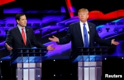 FILE - Republican U.S. presidential candidates Marco Rubio and Donald Trump speak simultaneously at a debate sponsored by CNN for the 2016 Republican U.S. presidential candidates in Houston, Texas, on Feb. 25, 2016.