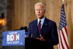 Democratic presidential candidate former Vice President Joe Biden speaks to local residents during a community event, Aug. 7, 2019, in Burlington, Iowa.