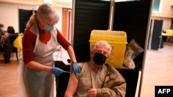 Dr. Susan Fairhead gives an injection of Pfizer/BioNTech COVID-19 vaccine at a vaccination center set up at Thornton Little Theatre managed by Wyre Council in Thornton-Cleveleys, northwest England, on Jan. 29, 2021.